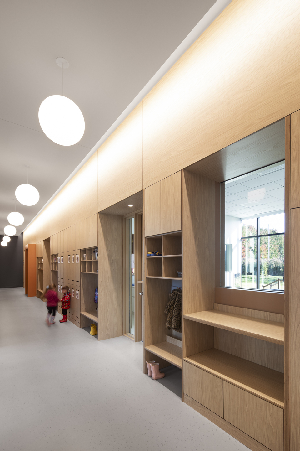 Children int he main hallway of the daycare.